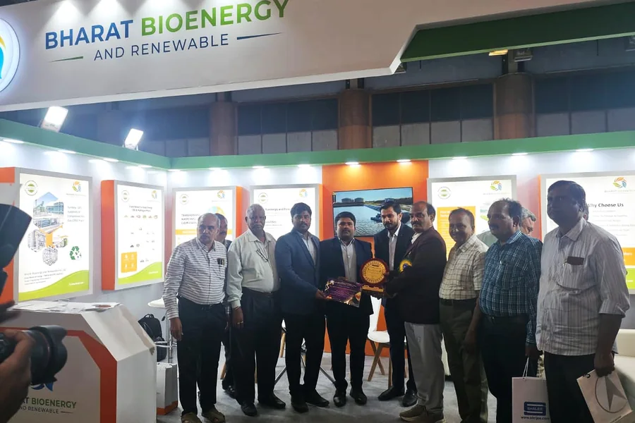Bharat Bioenergy & Renewable team receiving a plant recognition award at an industry exhibition